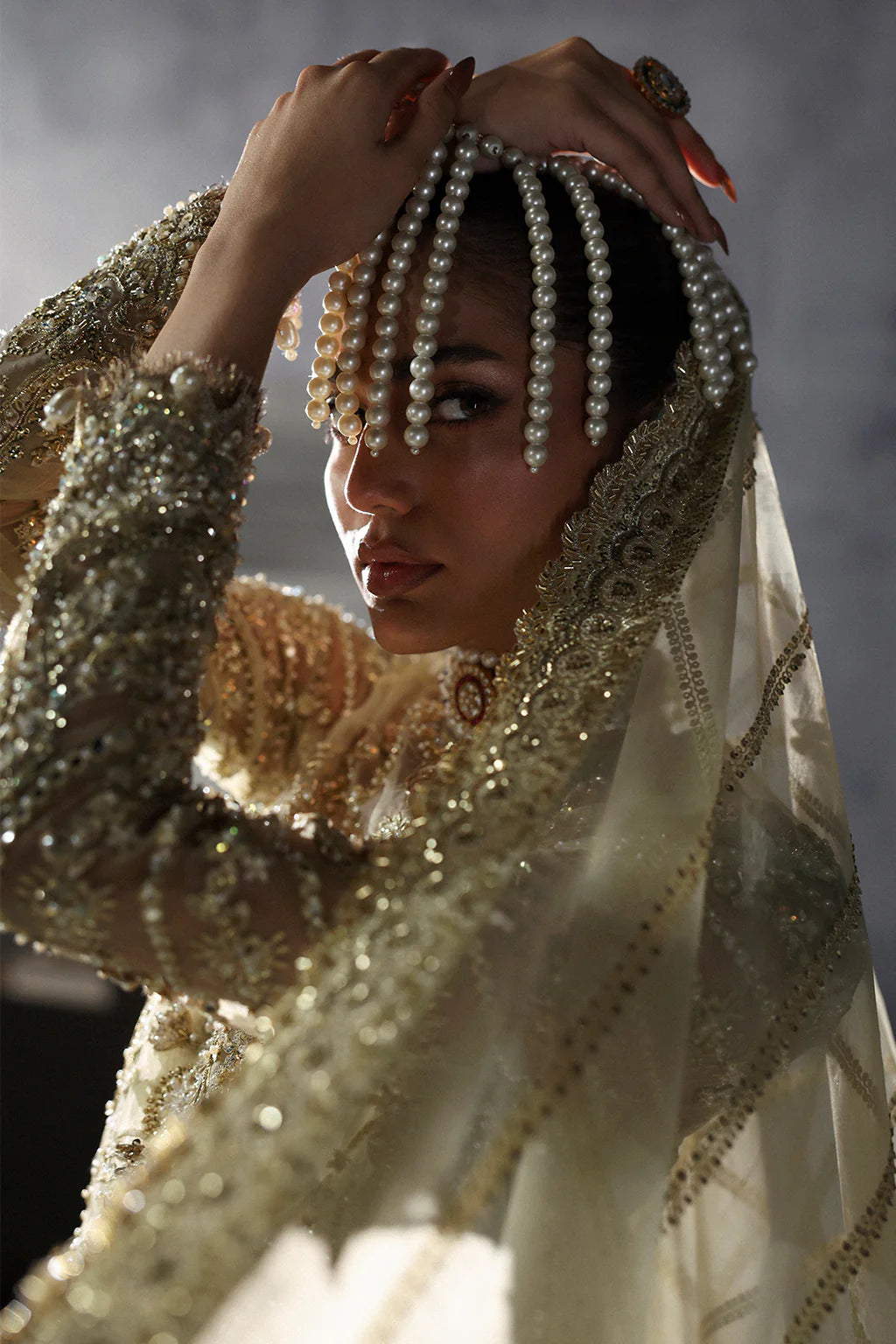 Orazio – Embroidered organza shirt with tilla, sequins, pearls, embellished lehenga, and panni-work organza dupatta.