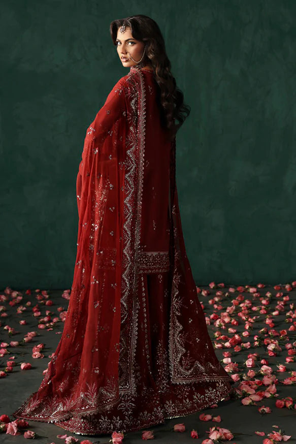 Tajdaar – Rust embroidered short shirt with raw silk sharara and chiffon embroidered dupatta.
