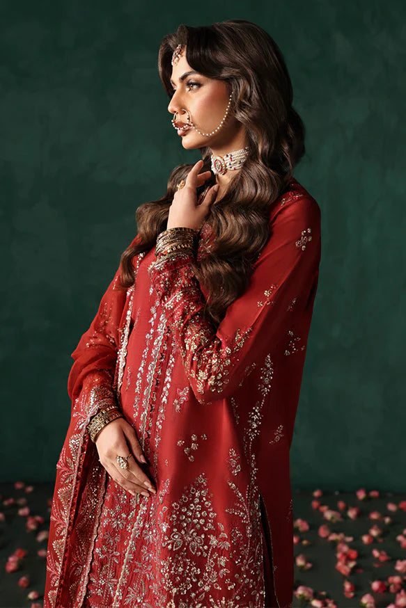 Tajdaar – Rust embroidered short shirt with raw silk sharara and chiffon embroidered dupatta.