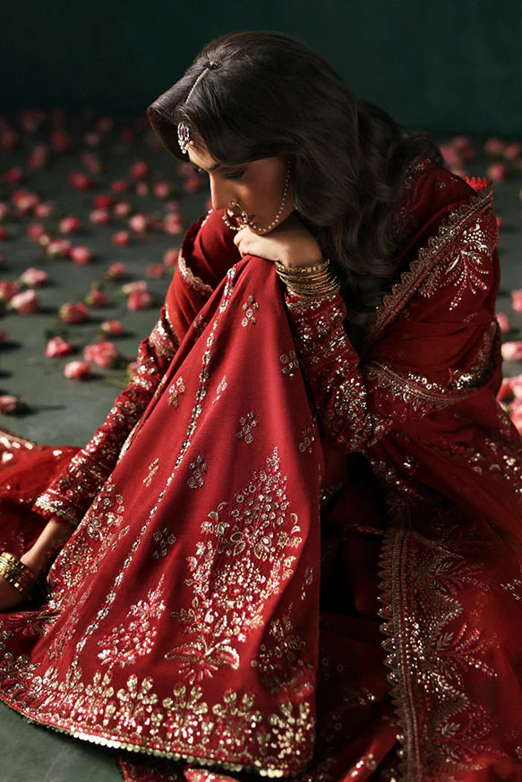 Tajdaar – Rust embroidered short shirt with raw silk sharara and chiffon embroidered dupatta.