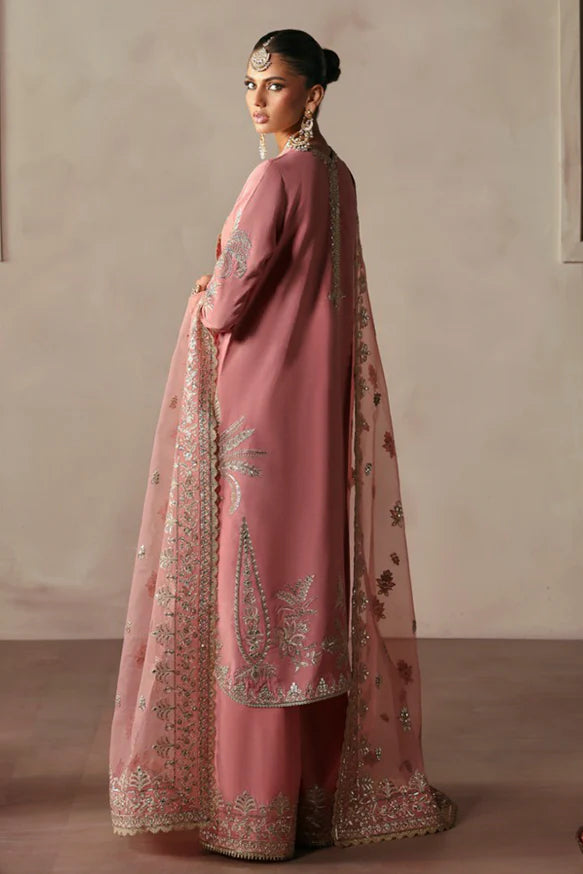 Gulrukh – Powder pink raw silk outfit with floral embroidery, golden panni, copper tilla, and embroidered dupatta.