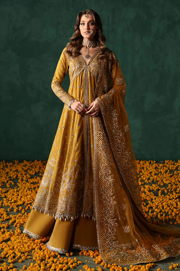 Jahanbano – Gold front-open peshwas with embroidered sharara, net dupatta, and raw silk trousers.