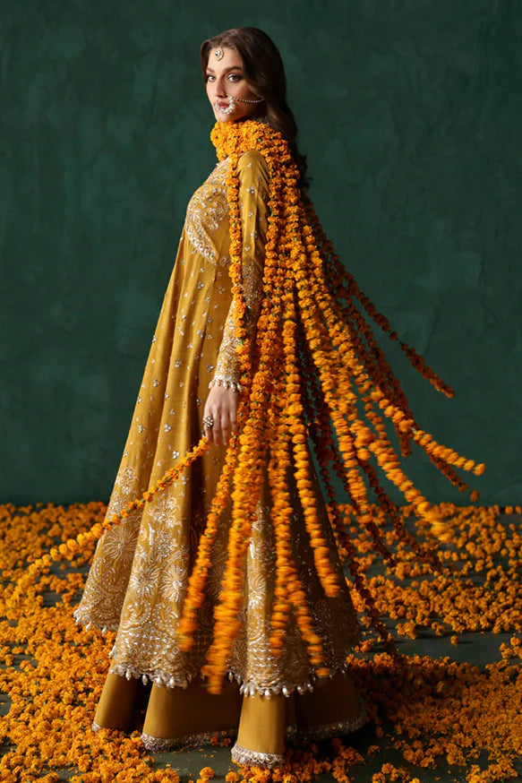 Jahanbano – Gold front-open peshwas with embroidered sharara, net dupatta, and raw silk trousers.